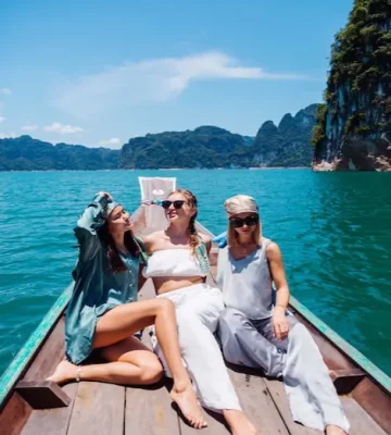 three-woman-tourists-friends-travel-around-khao-sok-national-park-vacation-thailand-sailing-asian-boat-lake-sunny-day-with-amazing-view_343596-1253 (1)